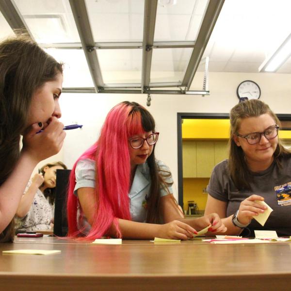 Trinity Padilla (left), Alondra Carlos-Ferrales (middle) and Bella Liffick (right) participate in an activity during an information science session.