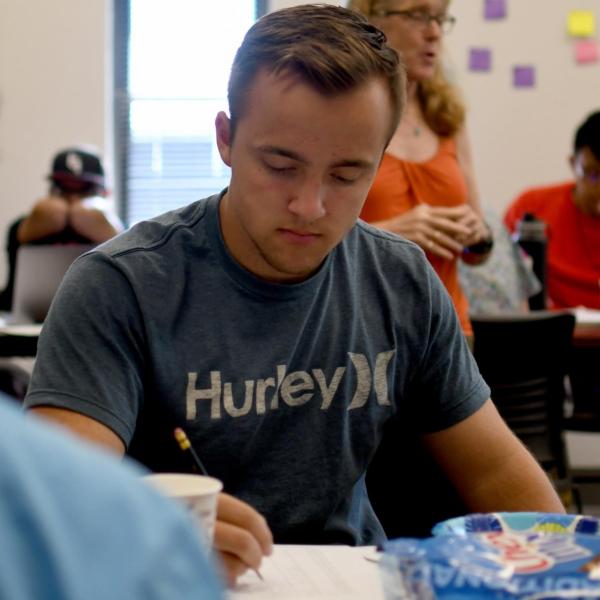 Adler Shannon takes notes during an academic skills session.