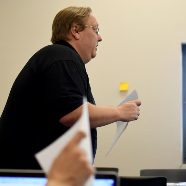 Everett Piper explains an assignment to the class.