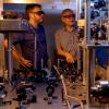 NIST scientists Greg Hoth (left) and Vladislav Gerginov work on NIST-F4, NIST’s new cesium fountain clock.
