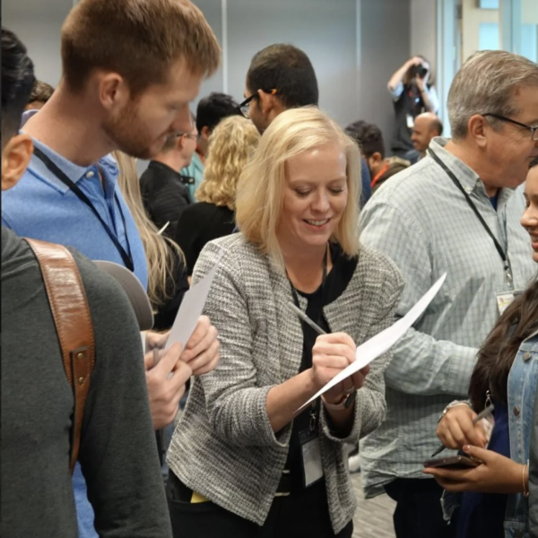 ME-EM Faculty Director Christy Bozic playing bingo with learners during a Coursera open house