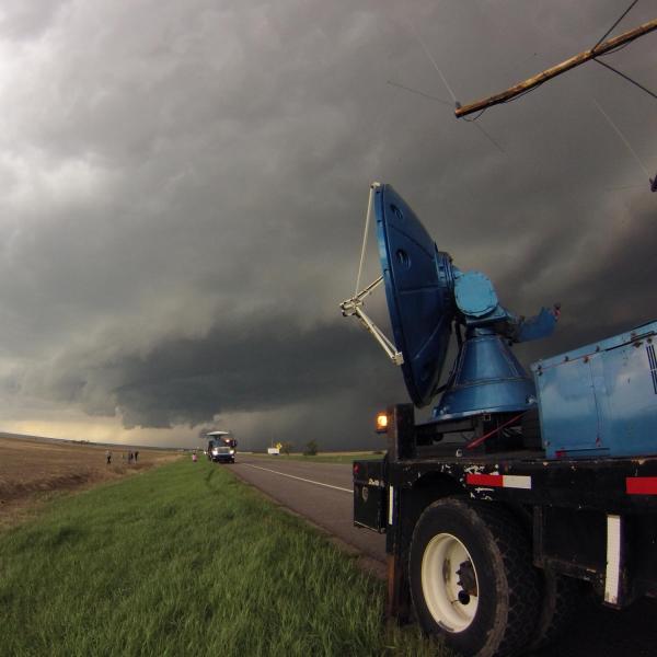 Two Doppler On Wheels (DOW) mobile radars scanning a supercell thunderstorm on the plains of Colorado on 21 May 2014. The DOWs are part of the Center for Severe Weather Research (CSWR) facility, and their goal is to collect radar and wind data on low-level tornado environments.