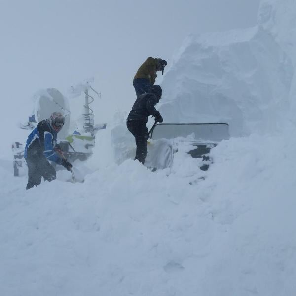 Digging out a truck buried by snow and wind at the Snowbank site (8,000 ft elevation) in central Idaho as part of the SNOWIE field project on 1 March 2017. A CSWR Doppler On Wheels (DOW) mobile radar is in the background and was used during the SNOWIE project to observe seeded and natural snowfall over the Payette River Basin. A commercial snowblower is on the left, which helped the crew reach the truck through 10-20 foot snow drifts.