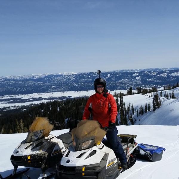 CU graduate student Josh Aikins snowmobiling to the Snowbank research site in central Idaho during the SNOWIE field project on 12 March 2017. The SNOWIE project ran between January and March 2017 and included manning two mountaintop mobile radars to collect data on the impacts of cloud seeding on mountain snowpack. This was one of Josh's daily commutes during the project.