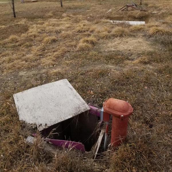 Graduate student, John Stults, working on a well water project in east Boulder County.