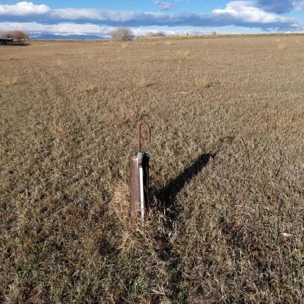 Graduate student, John Stults, working on a well water project in east Boulder County.