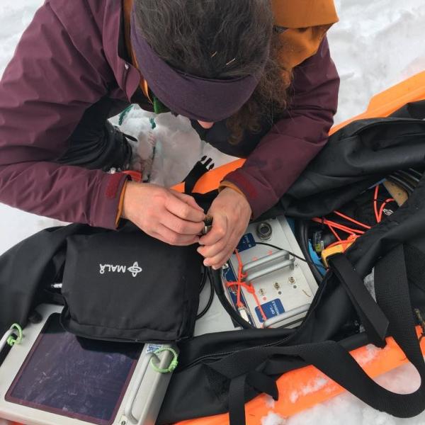 Investigating a malfunction within the ground penetrating radar (GPR) system while out in the field on the Grand Mesa during year one of the NASA SnowEx Campaign in February 2017.