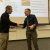 Teaching Associate Professor Mike Soltys and Dean Keith Molenaar shake hands