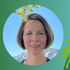 Joany Tisdale against the backdrop of a green to blue gradient and drawn earth with stylized energy sources