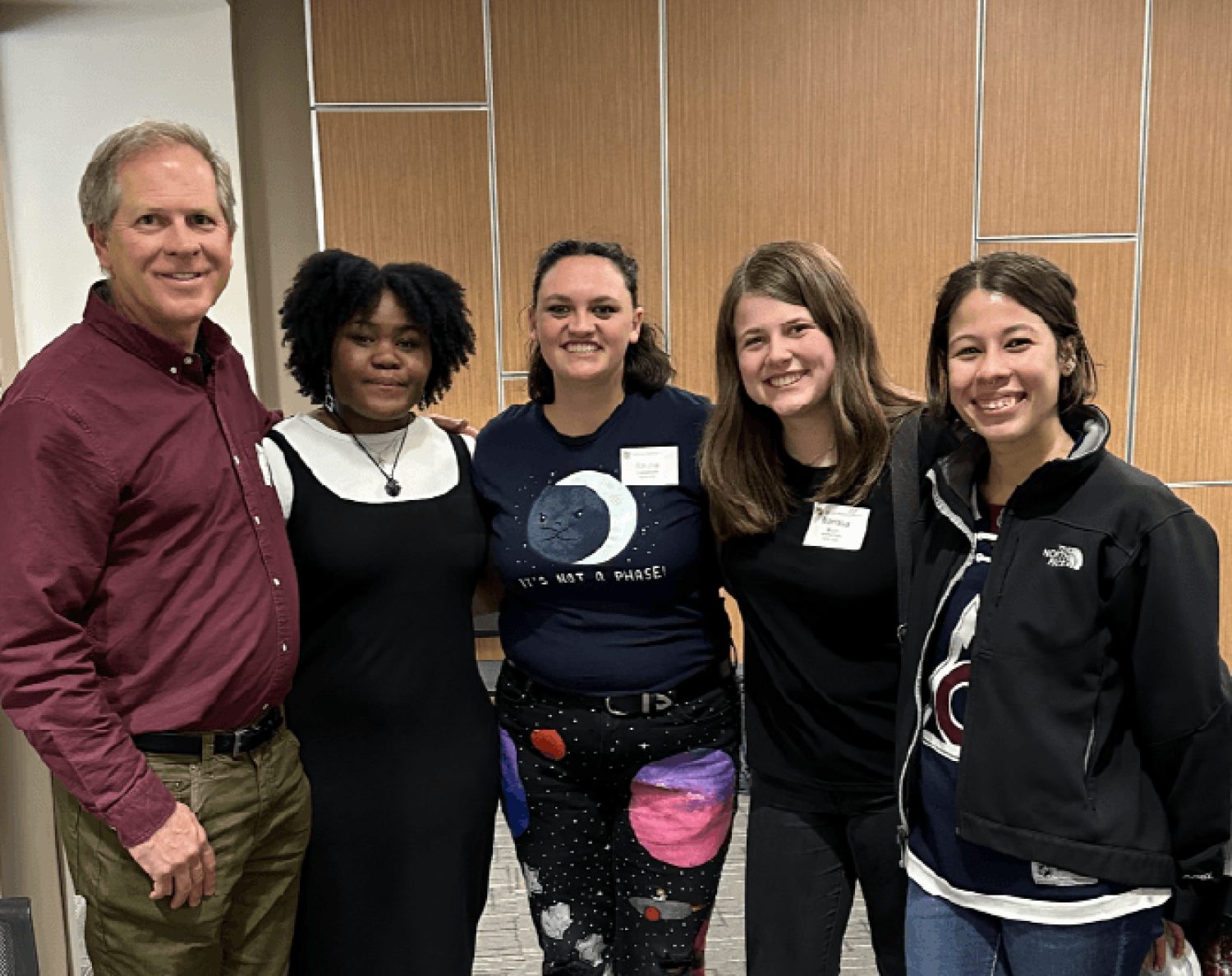 Samantha standing with other mentors and faculty