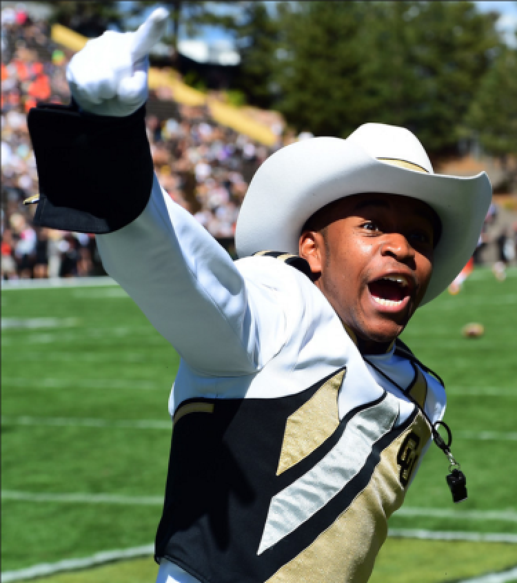 Floyd cheering wearing a cowboy hat in the marchingband