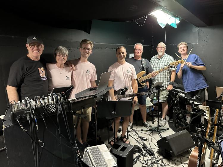 Collin in a group all holding instruments