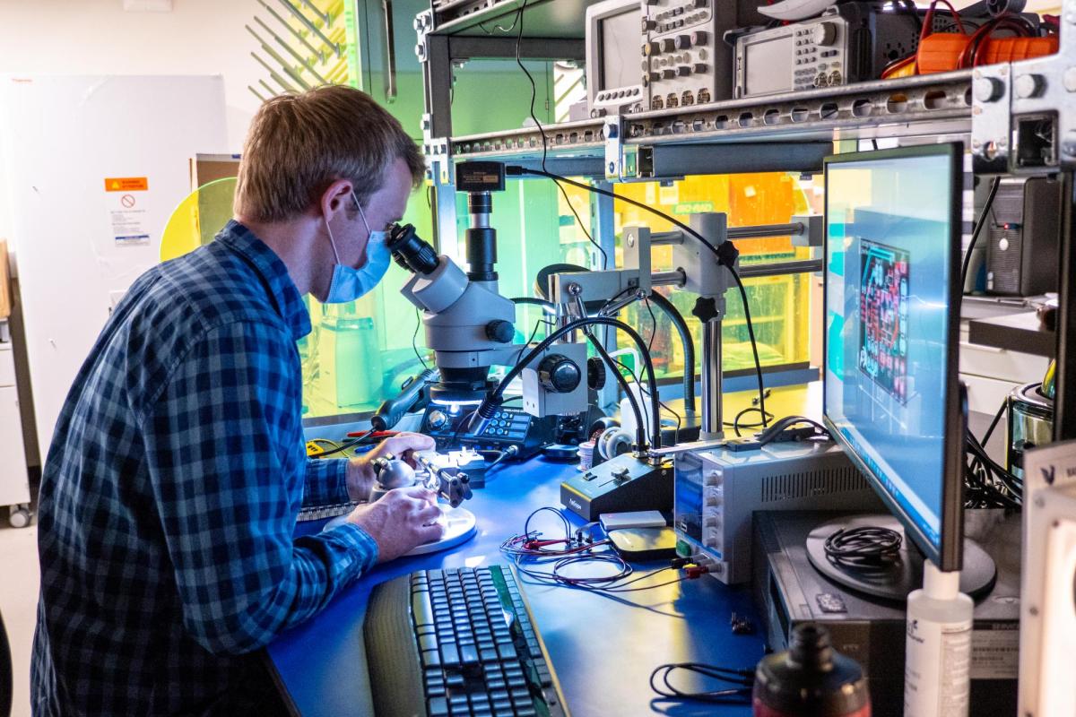 Student working at a microscope.