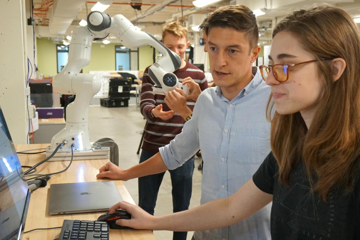 Two people working at a computer