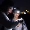 Kaushik and student in a field at night