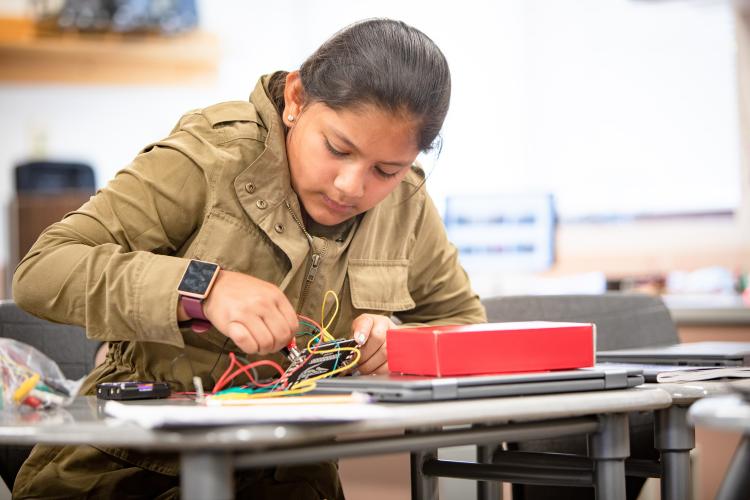 youth working with sensors on their project