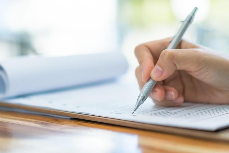 Hand writing on paper for an application