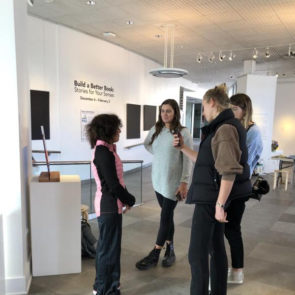 Artist Luanne Burke talking with students