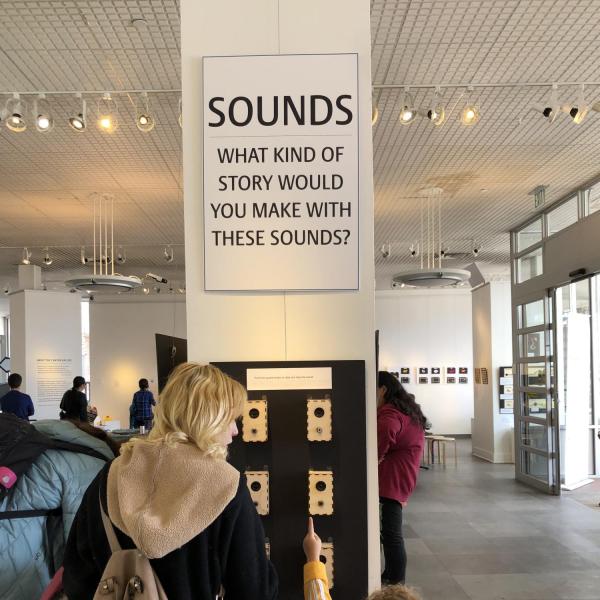 Adult and child exploring different sounds for stories.