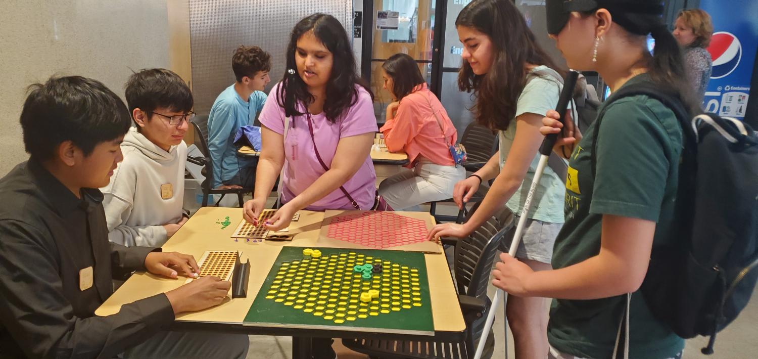 A group of people discovering tactile games
