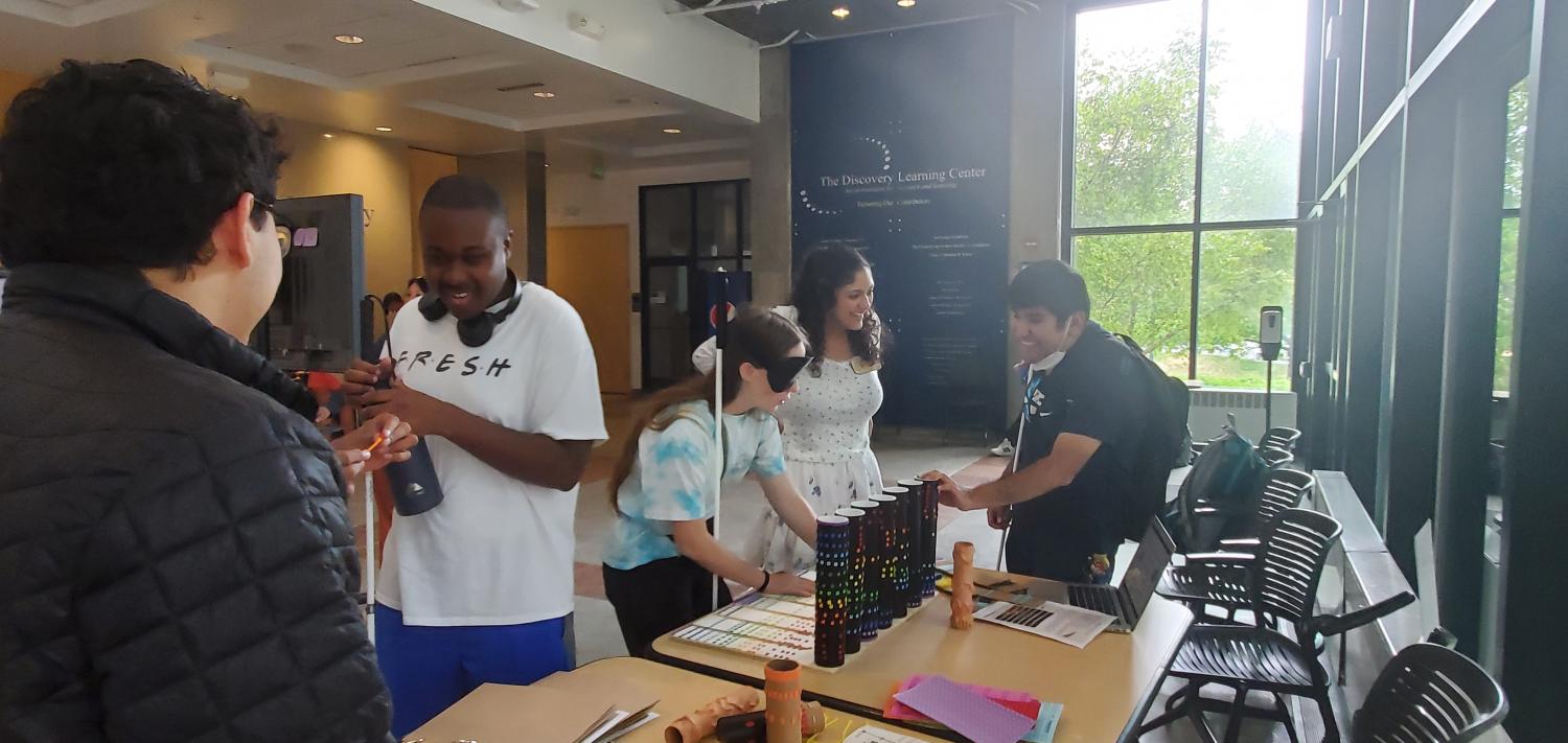 people looking at a game on a table