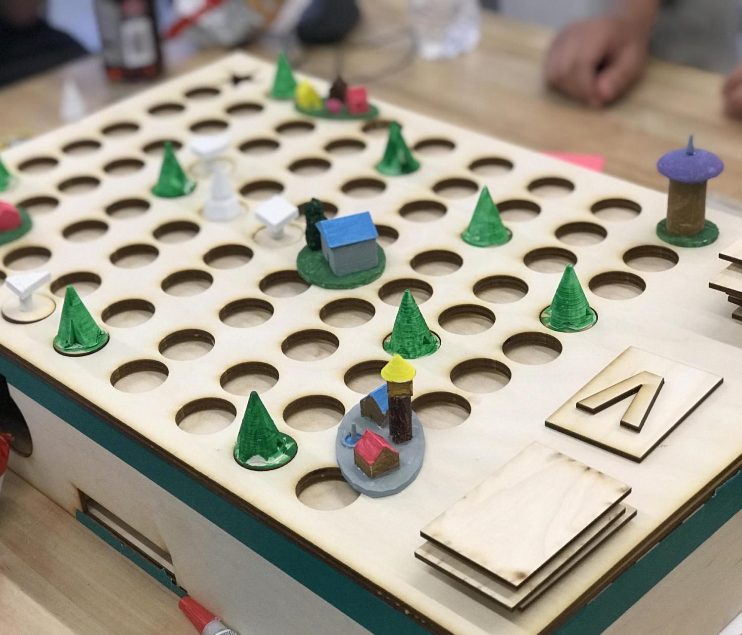 Forest journey board game created with laser cutter.