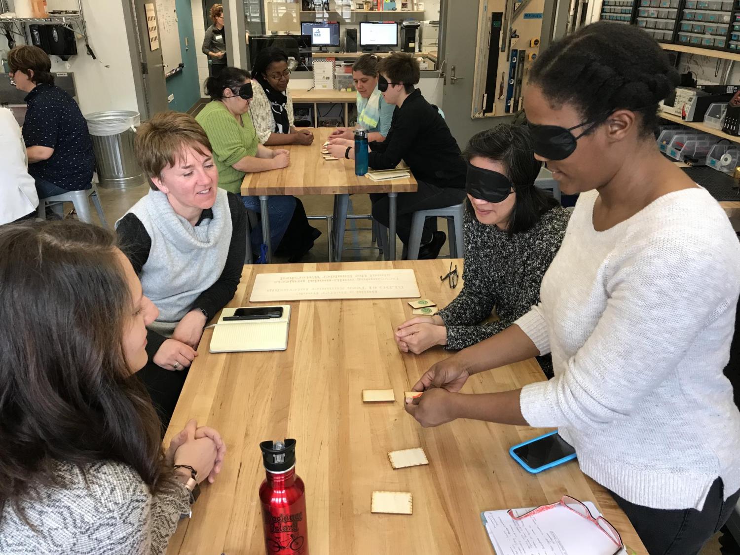 People playing a game with blindfolds.