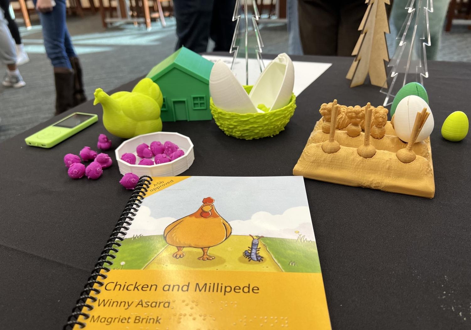 3D printed objects and braille book on chickens.