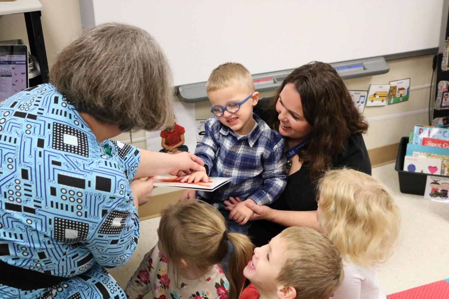 Sharing a tactile board book with preschool students