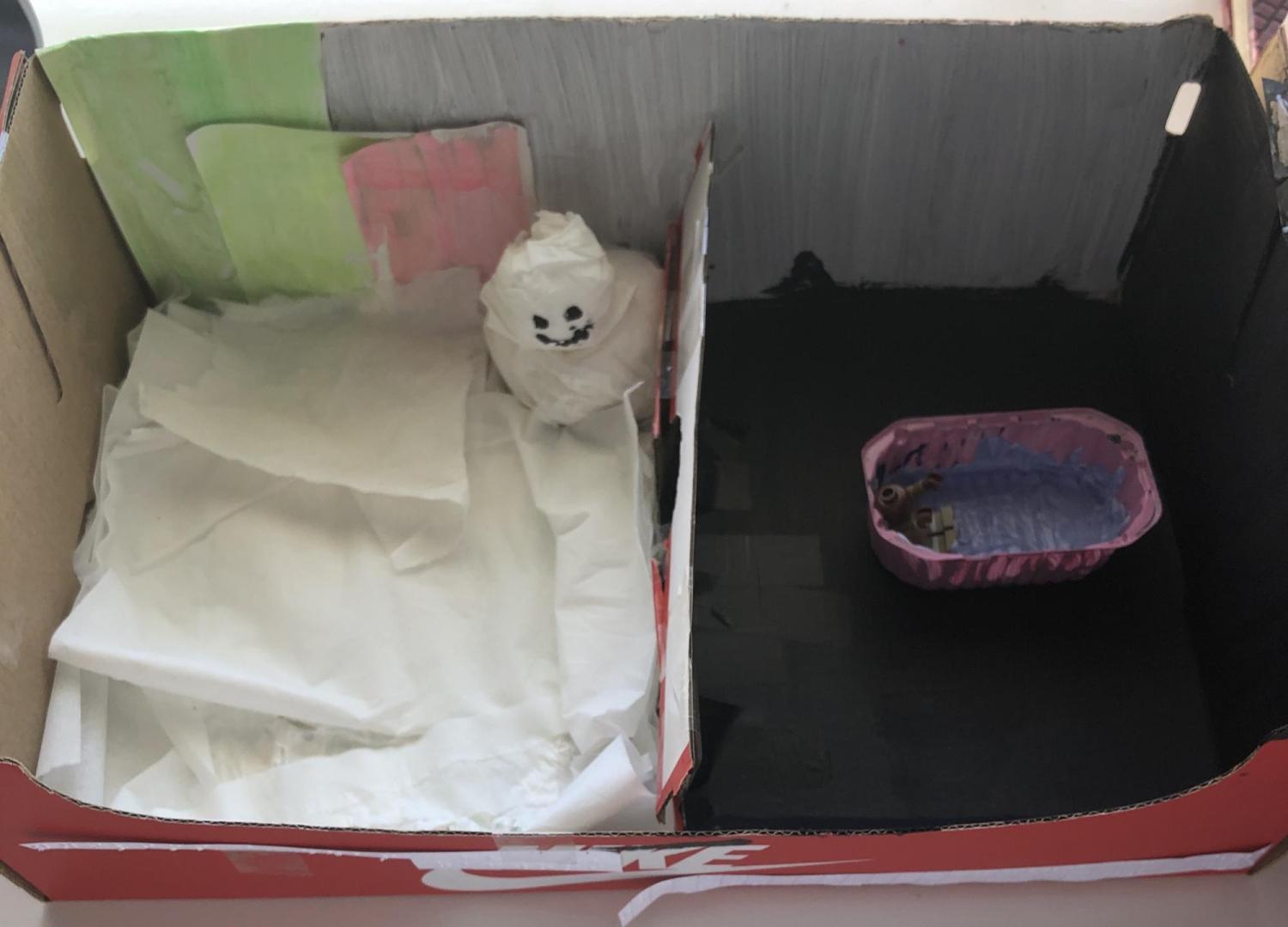 diorama of snowman and of boy in bathtub