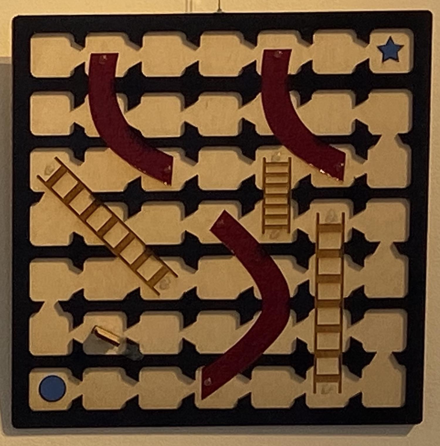 Tactile gameboard for Chutes and Ladders with high contrast colors.