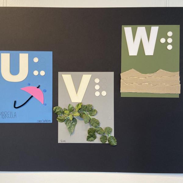 Alphabet panels for letters U,V,W showing an umbrella, vine, and water.