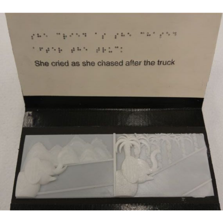 Book with 3D printed tactile image of elephants with braille and text placed above image.
