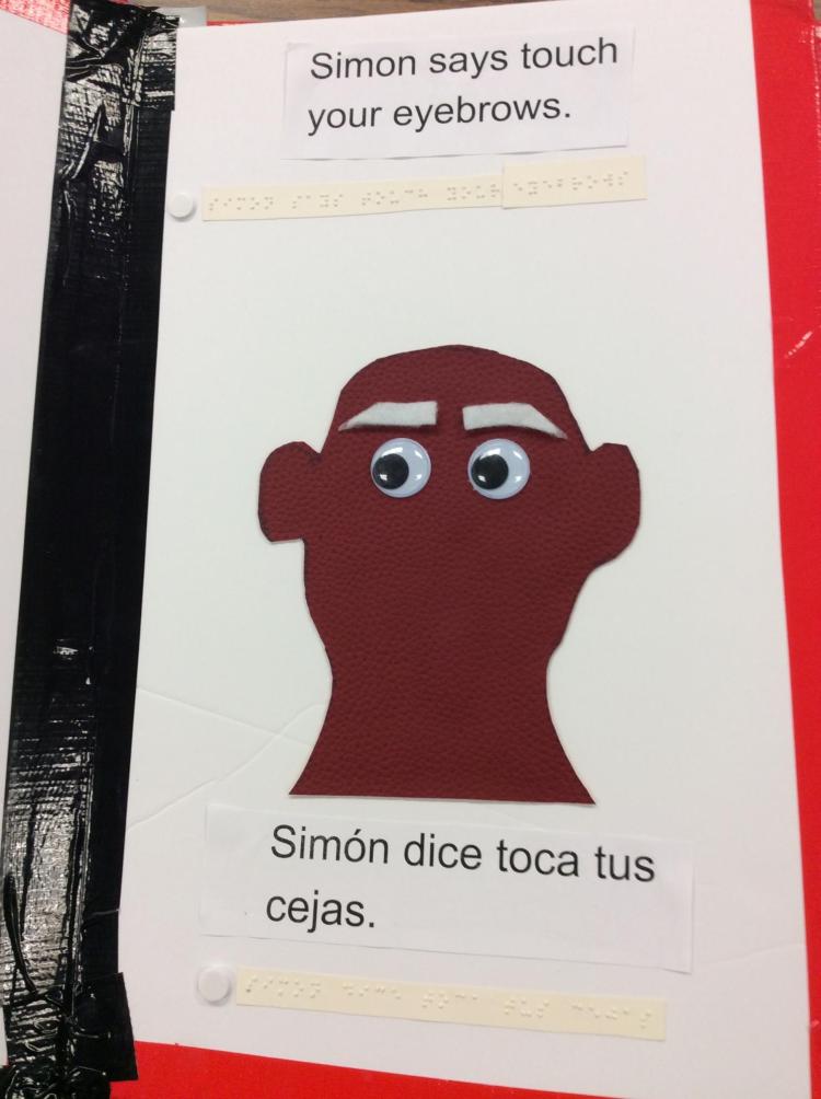 Page showing a head outline with google eyes and large felt eyebrows.
