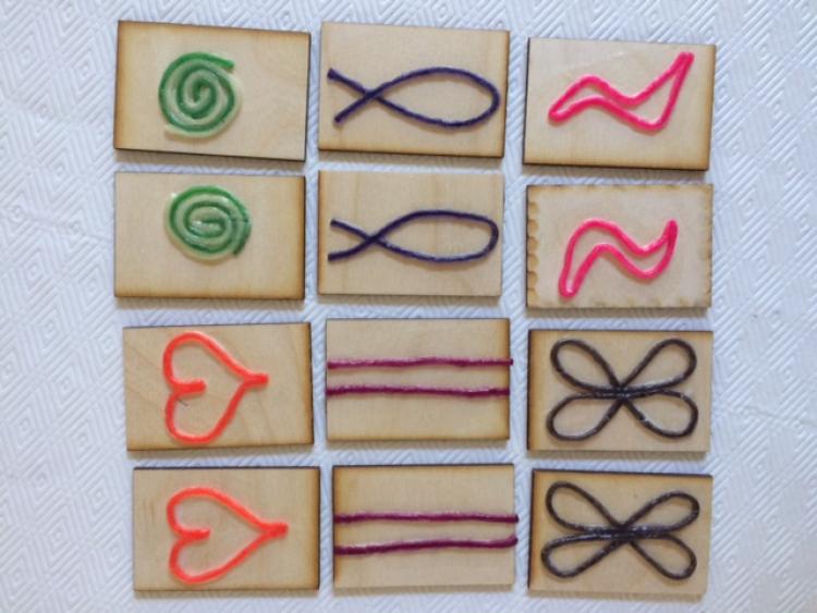 Tactile cards with raised symbols made from wax sticks
