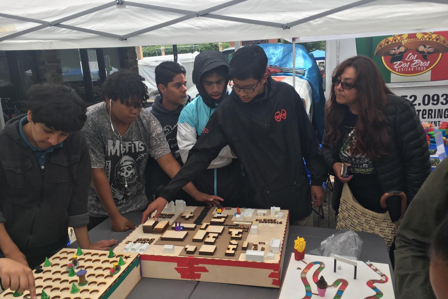 teens showcasing tactile boardgames
