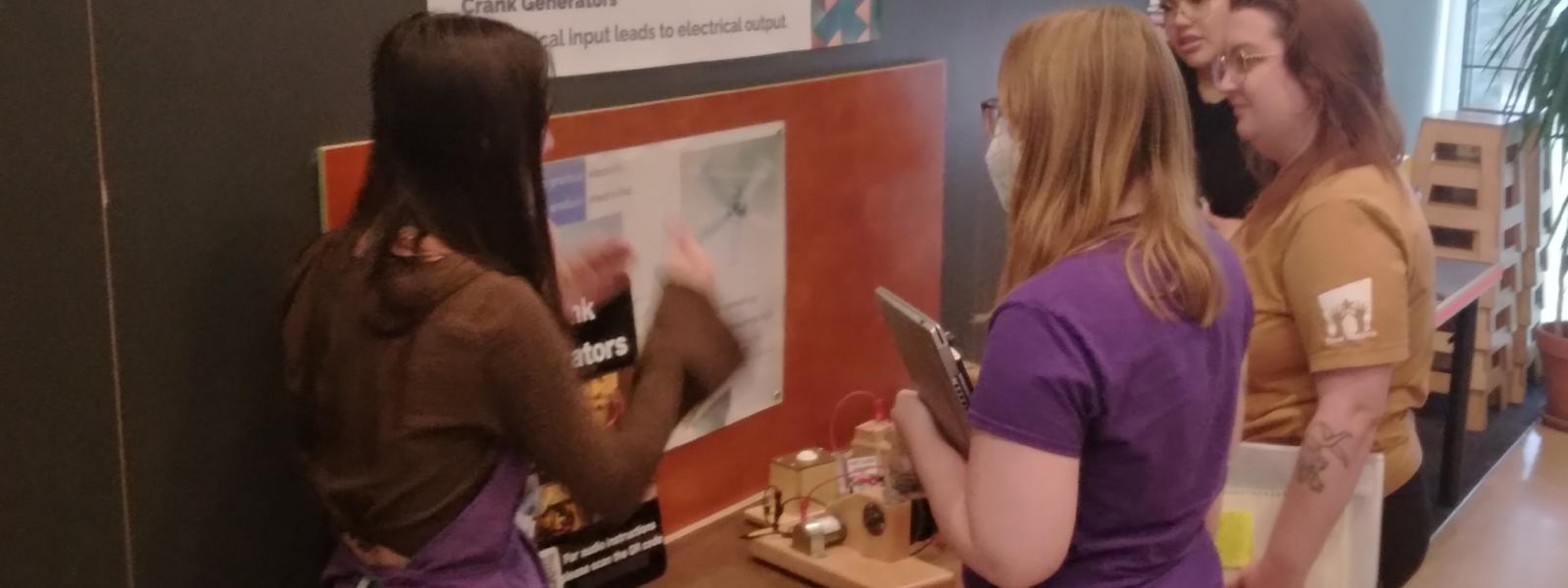 An intern explains her project to others