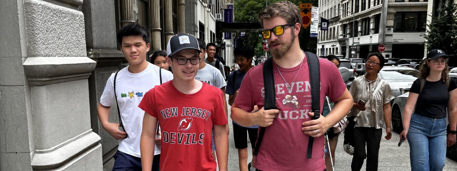 teens walking down a street