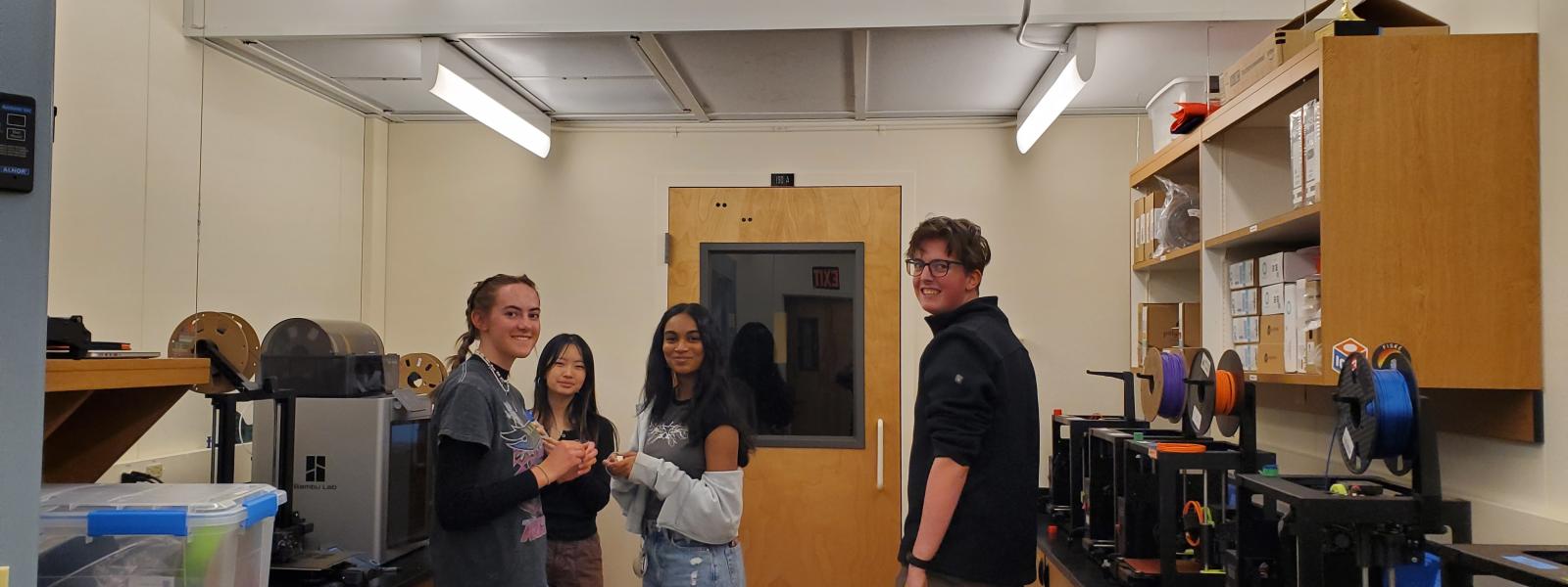 A group of teens in a 3D printing room
