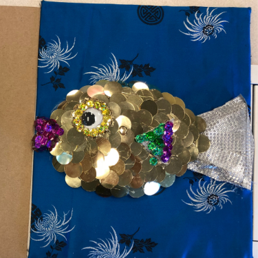 Tactile fish with large sequins scales and fabric tail.