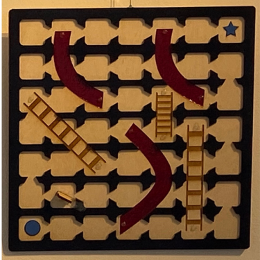 Tactile gameboard for Chutes and Ladders with directional guided playing spaces.