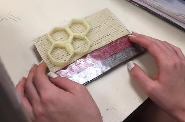 Close up of honeycomb cells made from wikkisticks.