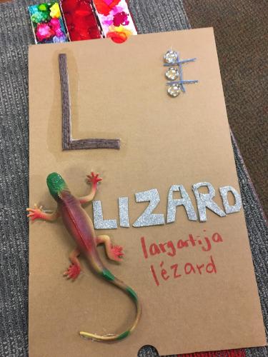 L is for Lizard alphabet page with braille