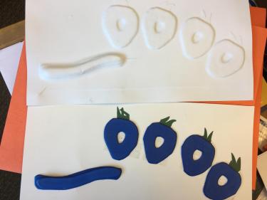 3D relief model of caterpillar and strawberries