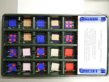 Board Game box showing tactile memory game pieces in a grid.