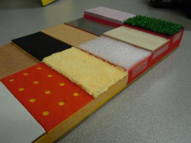 Stepped box with different texture swatches.