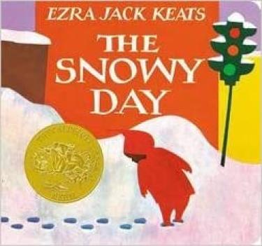 Boy in a red snow suit playing in the snow.
