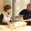 Two workshop participants sharing ideas.