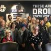Attendees for Professional Development posing in front of a Star Wars poster.