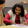Team member Shalini Menon feels a tactile diagram of an eye.